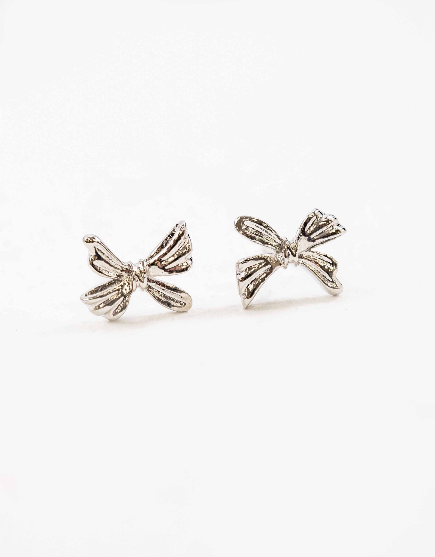 Ample Bow Charm Earrings | Silver