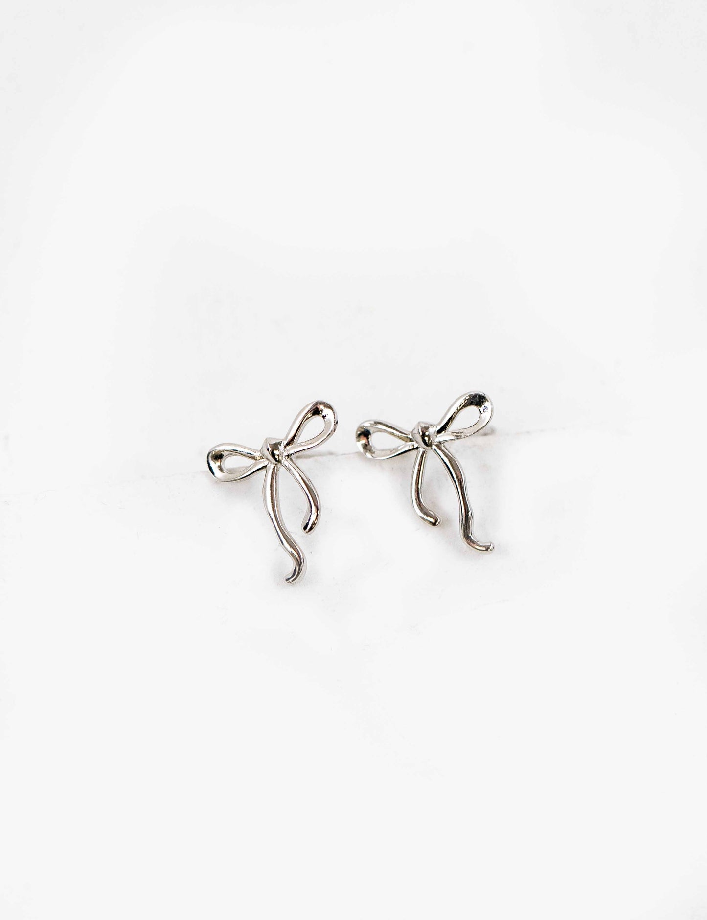 Curled Bow Charm Earrings | Silver