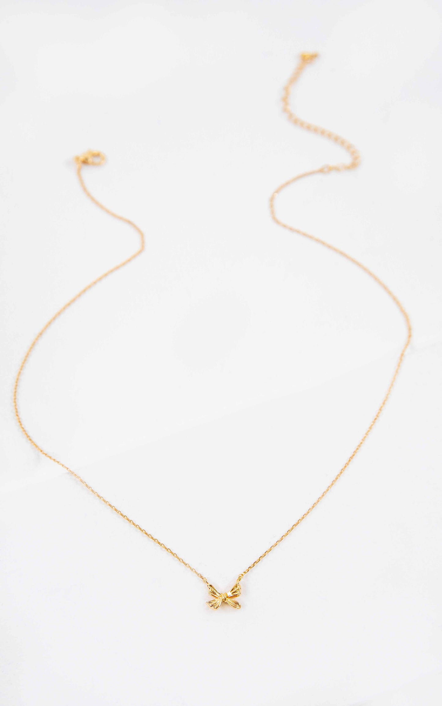 Ample Bow Charm Necklace | Gold