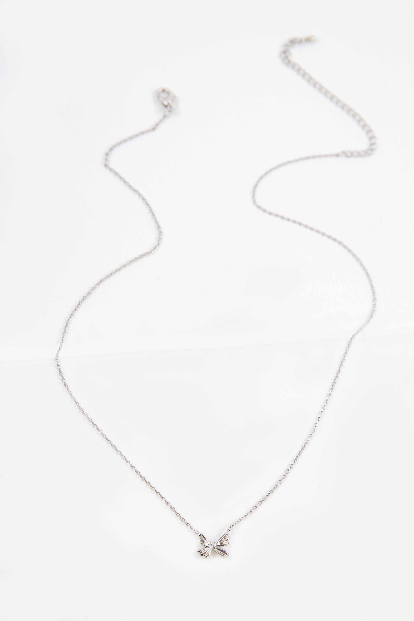 Ample Bow Charm Necklace | Silver