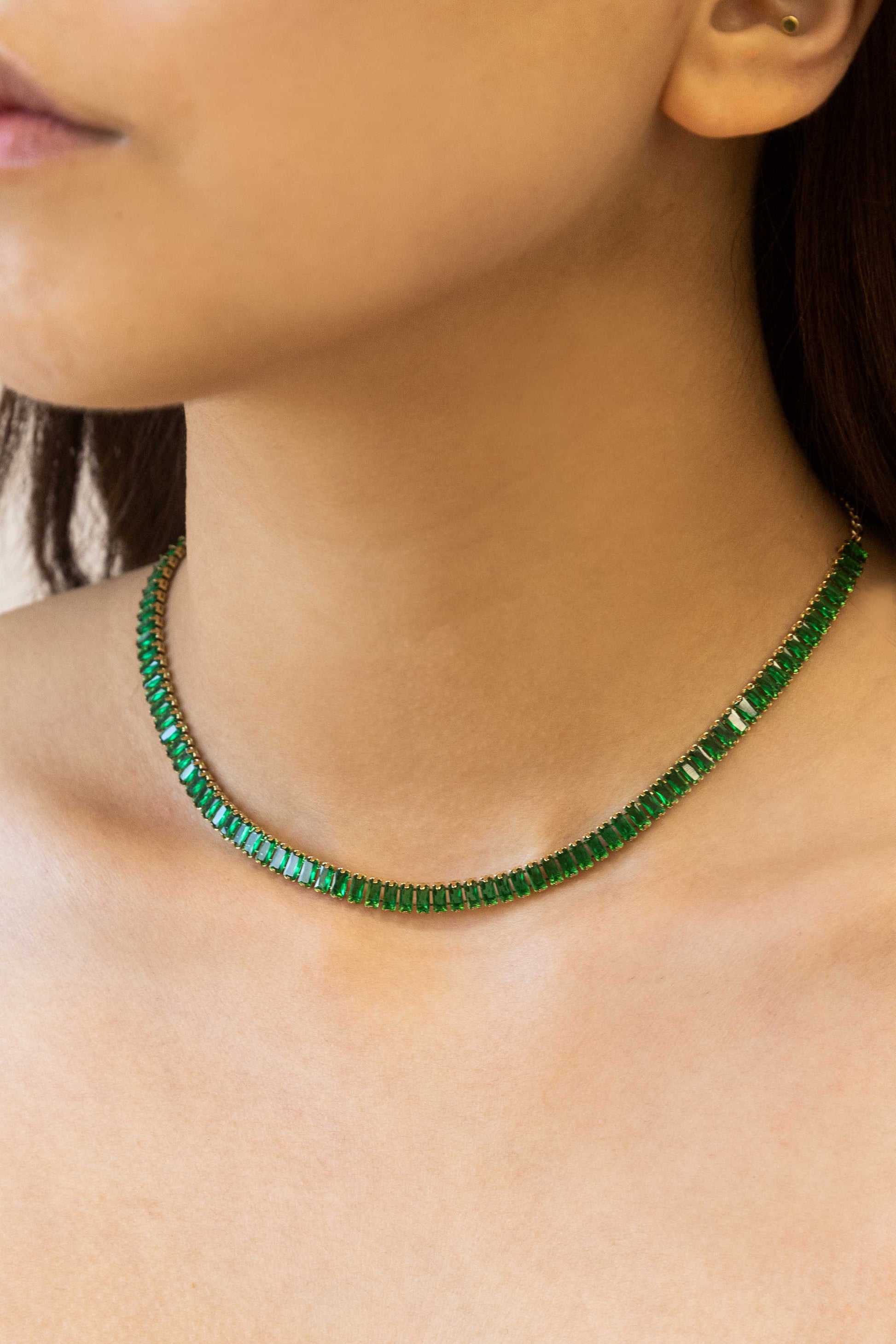 Fancy tennis necklace with emeralds and diamonds